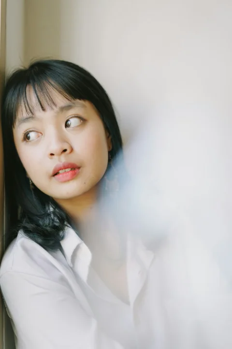 woman in white collared shirt