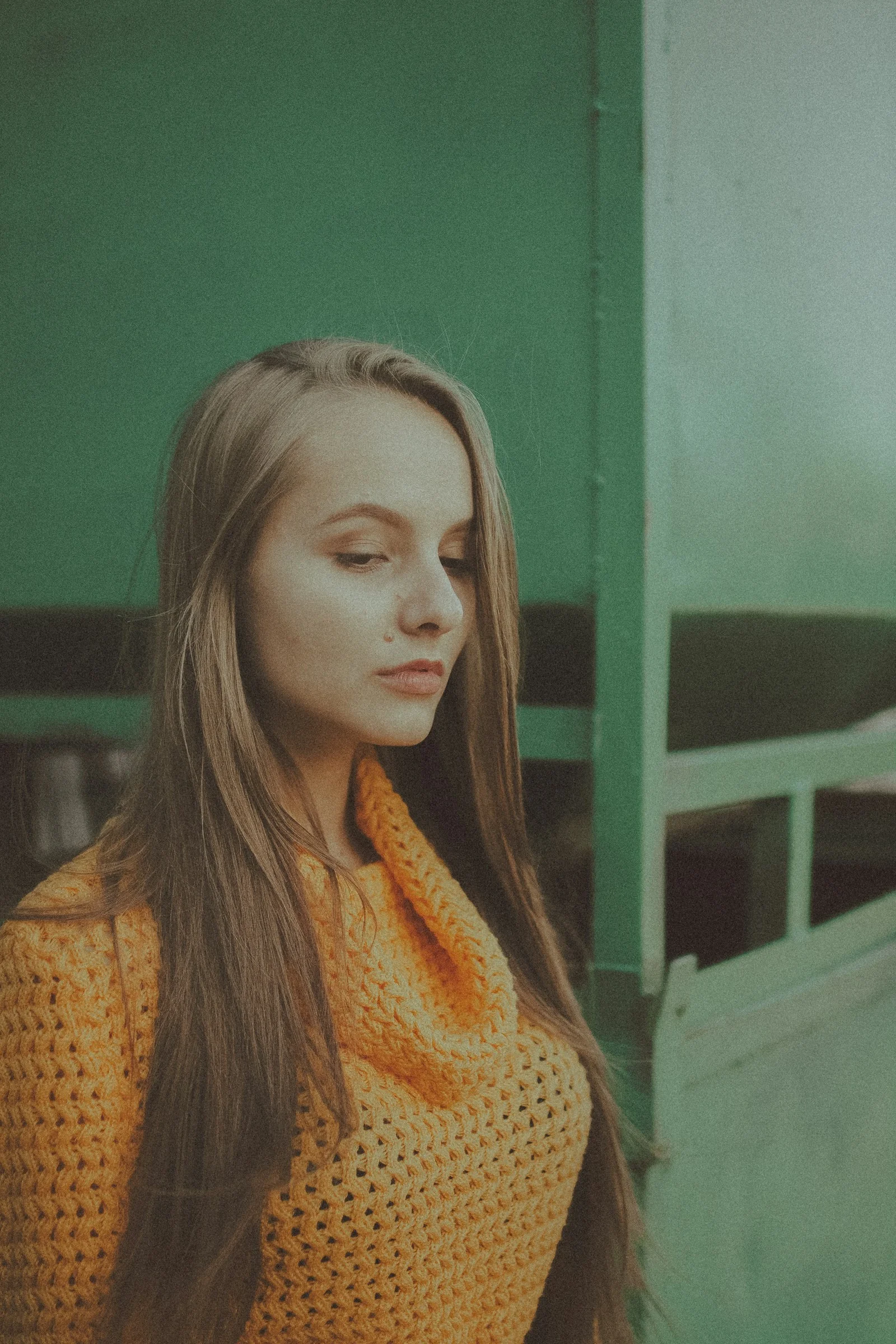 woman in yellow knit sweater