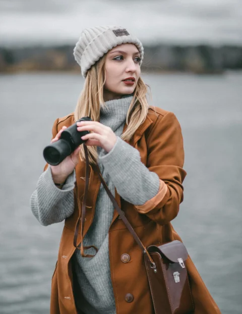 a person holding a camera