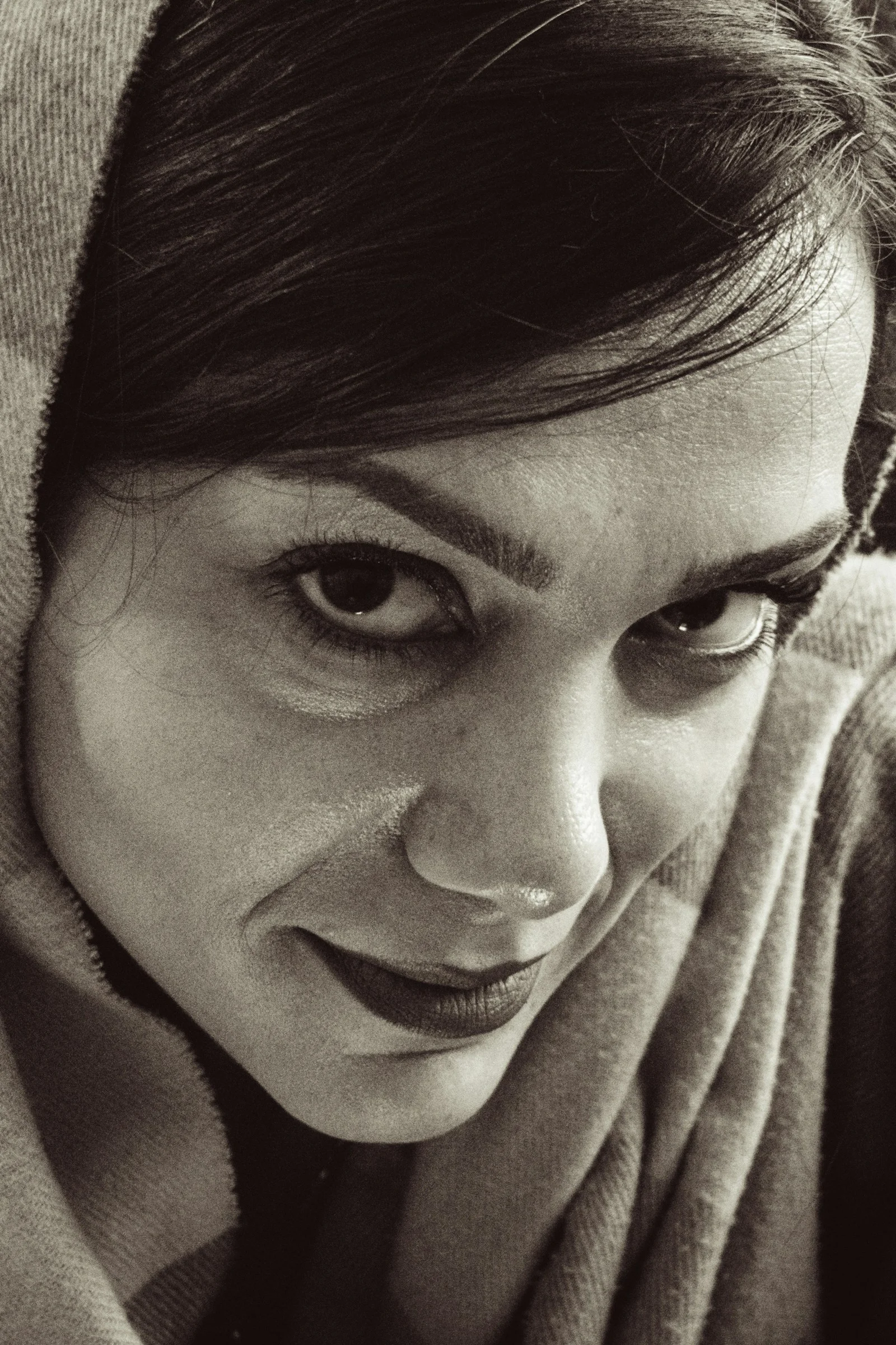 Close-up of a woman's face with a headscarf