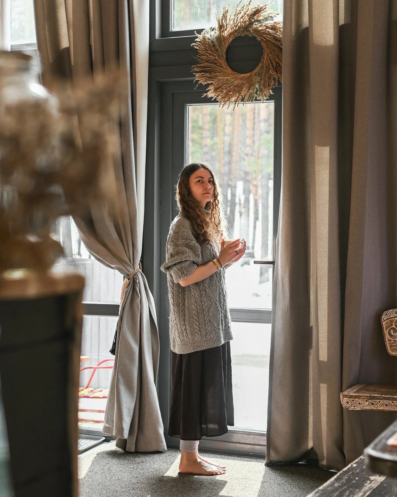 a woman standing in front of a door