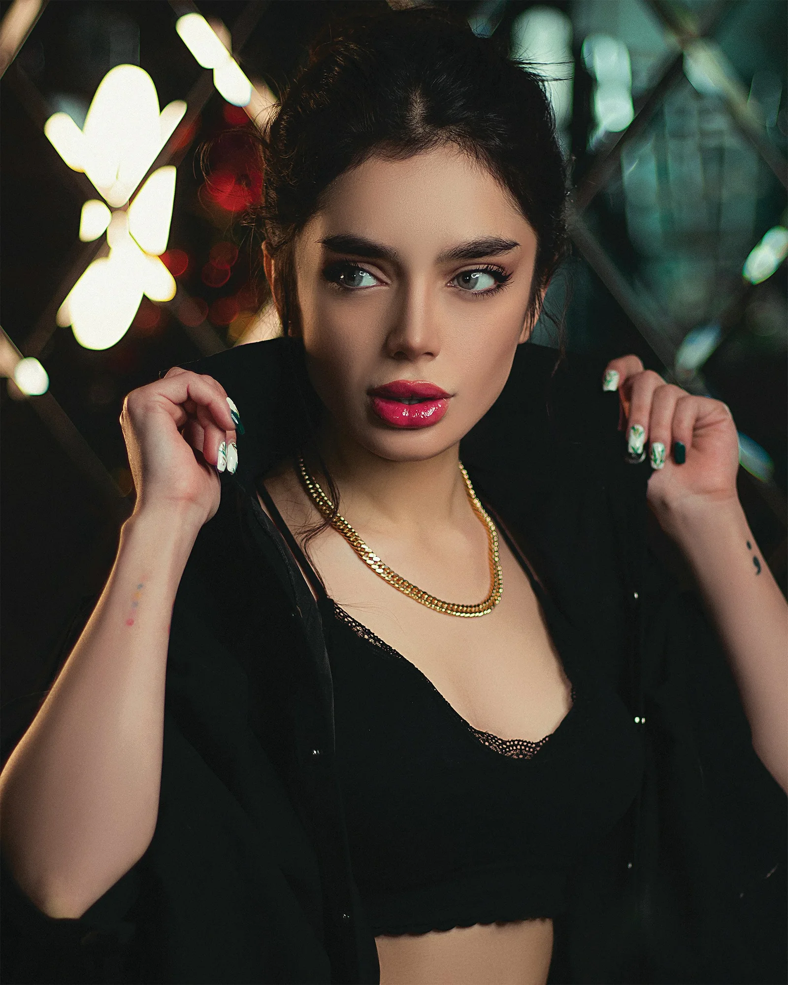 woman in black scoop neck shirt with silver necklace