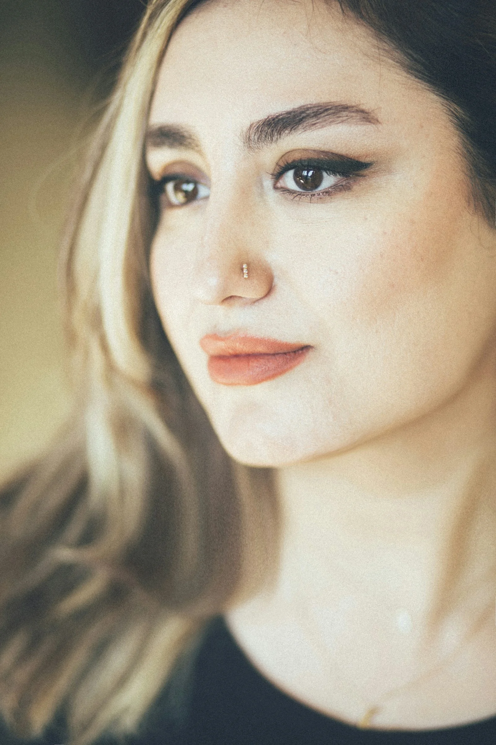A close up of a person wearing a necklace