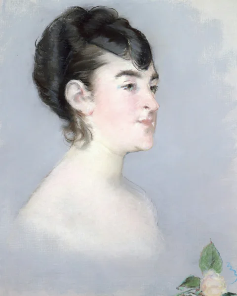 A woman in profile with dark hair and a rosebud