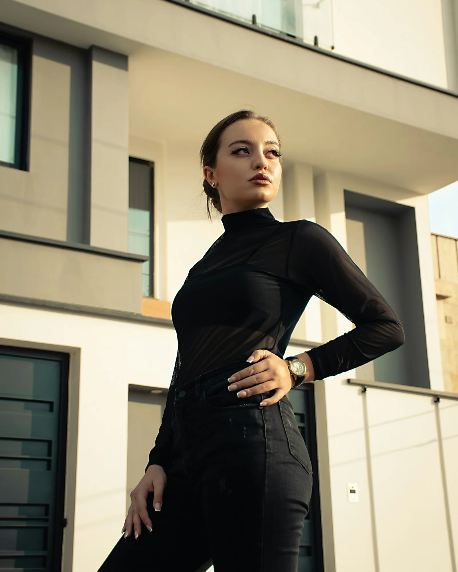 A woman standing in front of a building