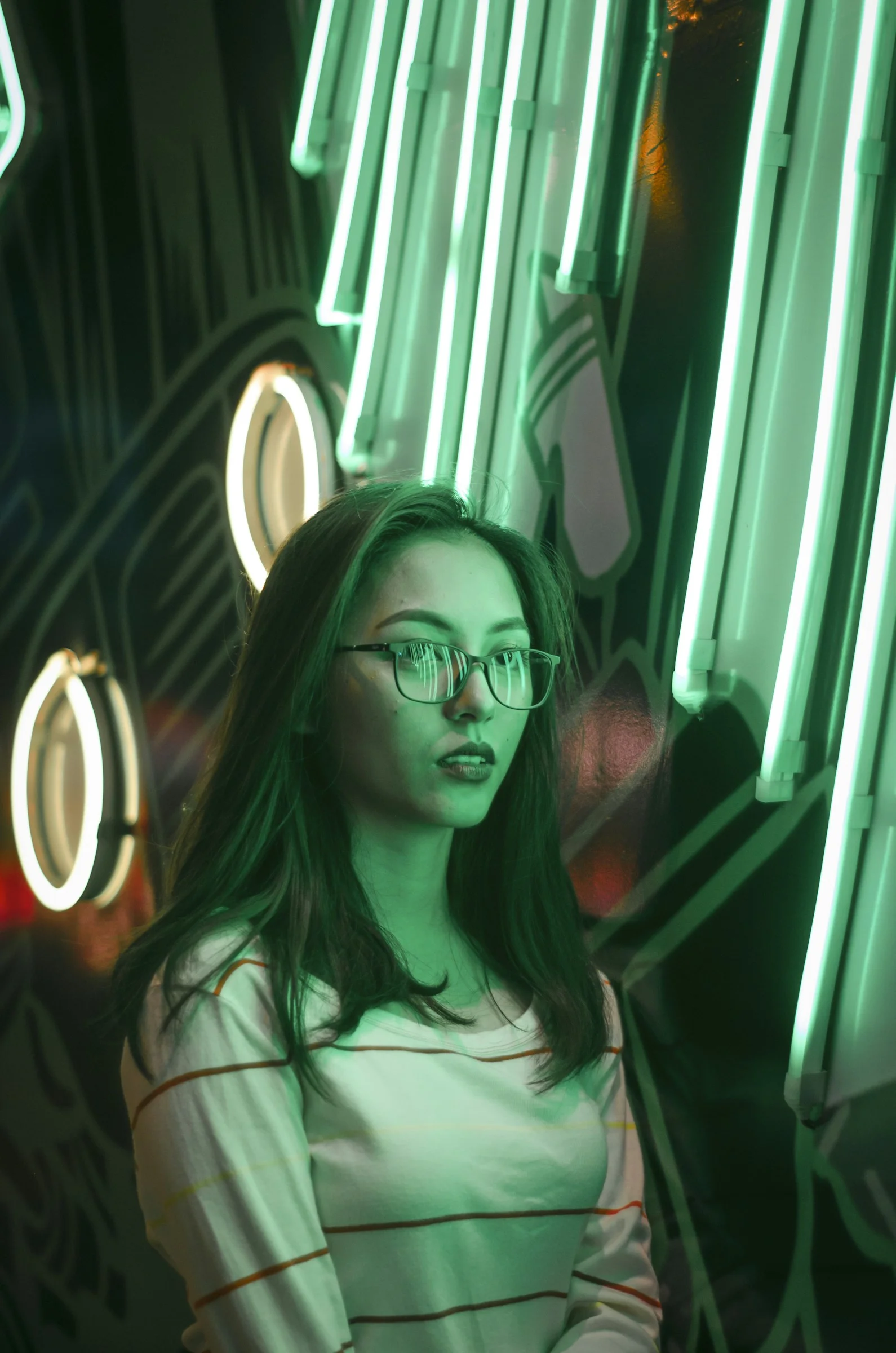 woman in white shirt wearing black framed eyeglasses