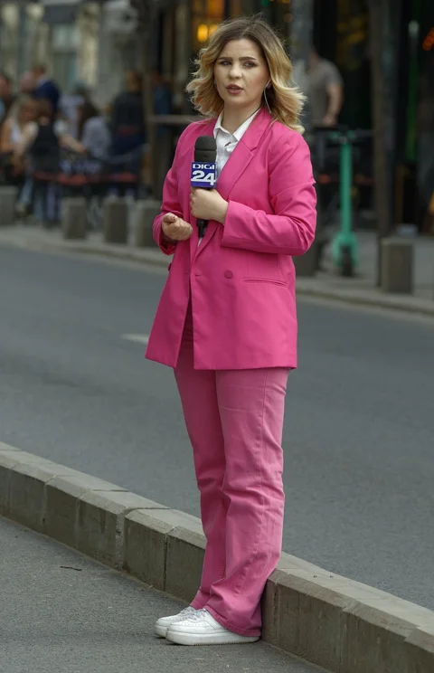 woman, pink suit, reporter, microphone