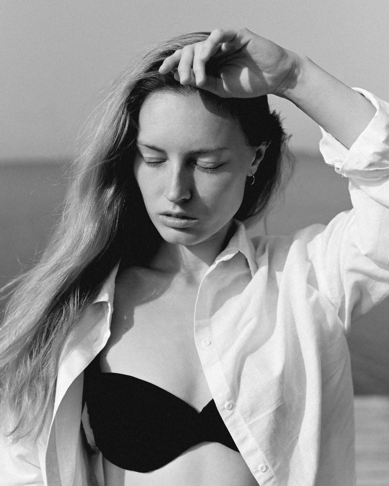 a woman with her hand on her head