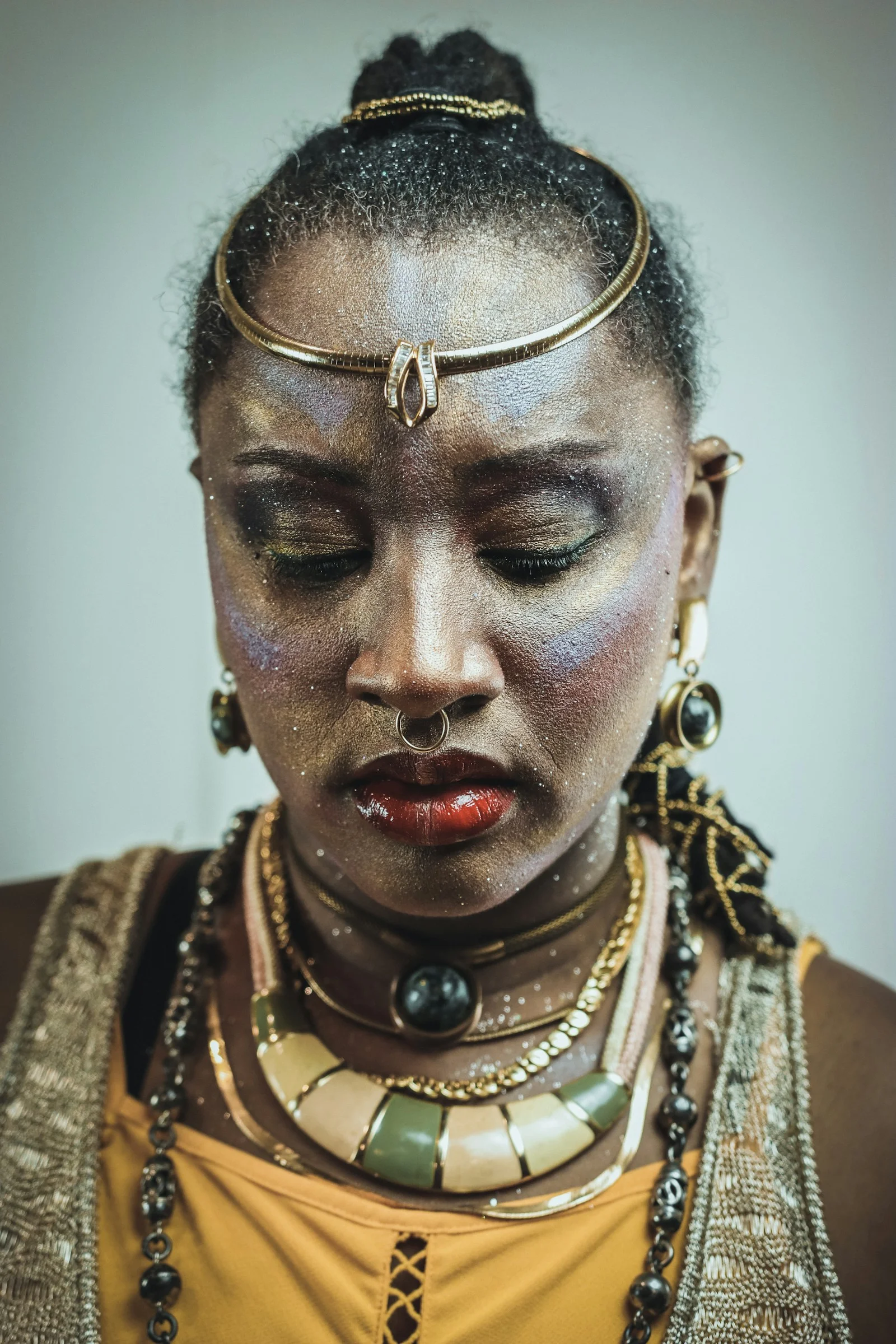 Woman with elaborate makeup and jewelry
