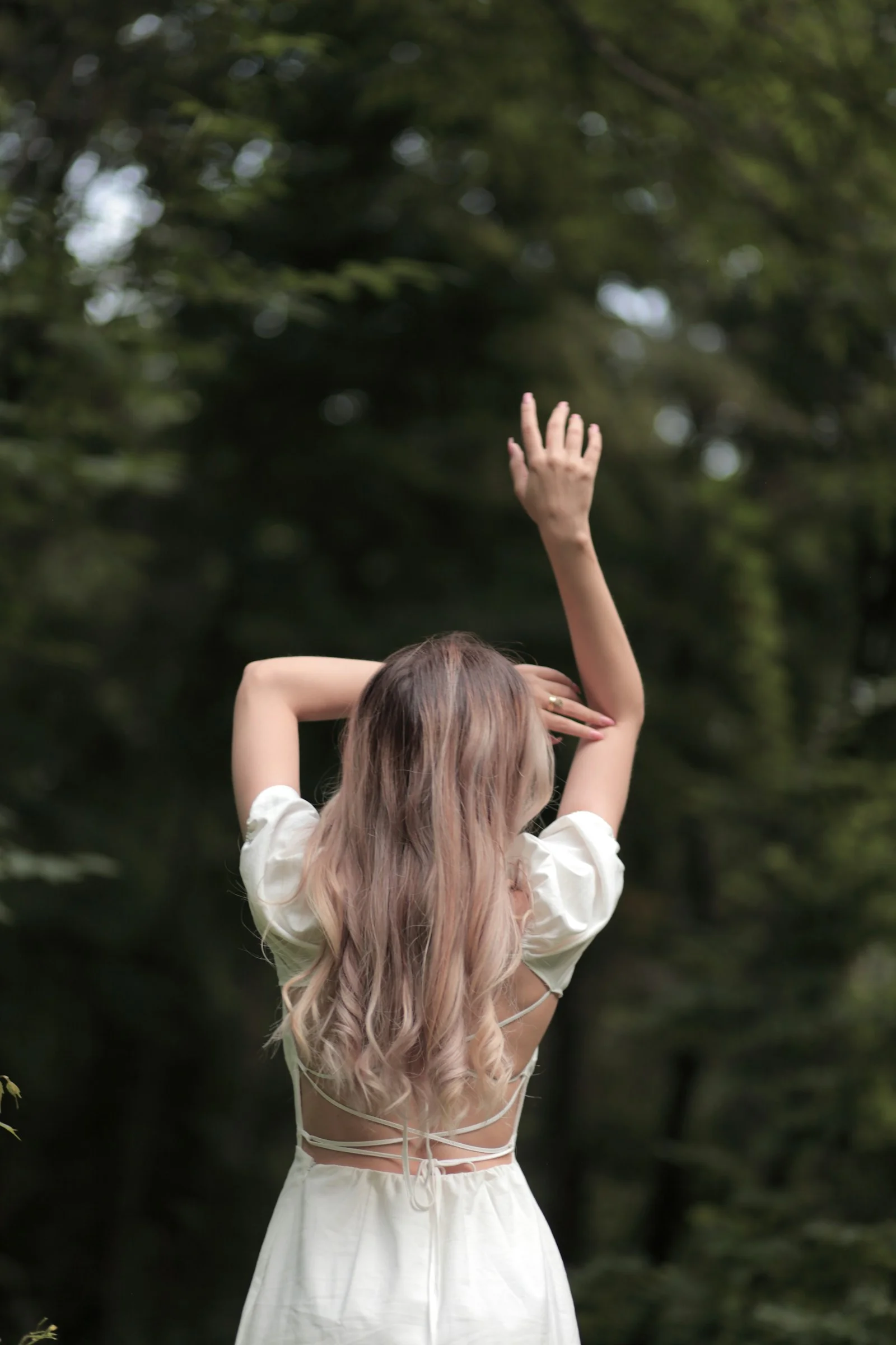 a woman with her hands up