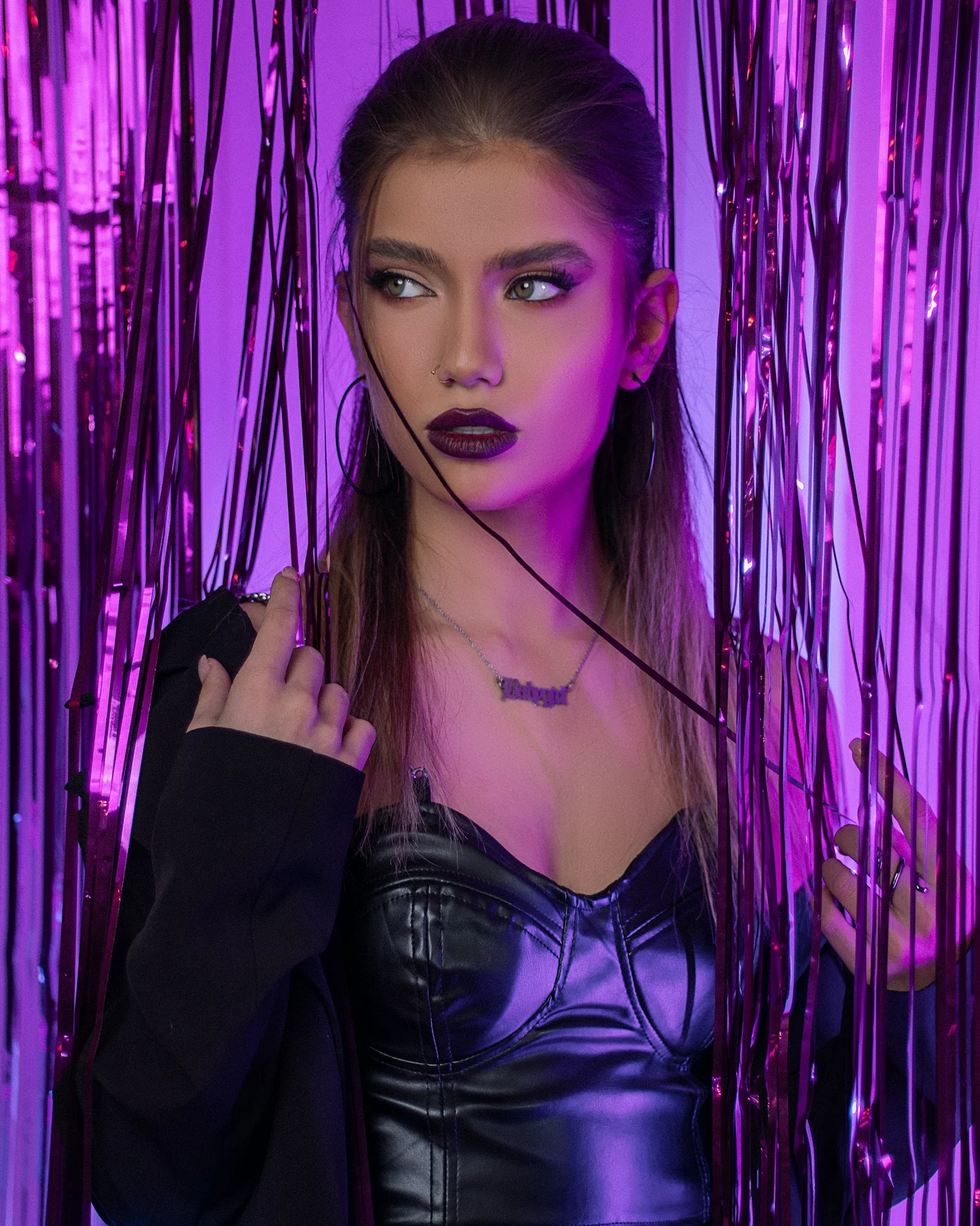 a woman in a leather outfit posing for a picture