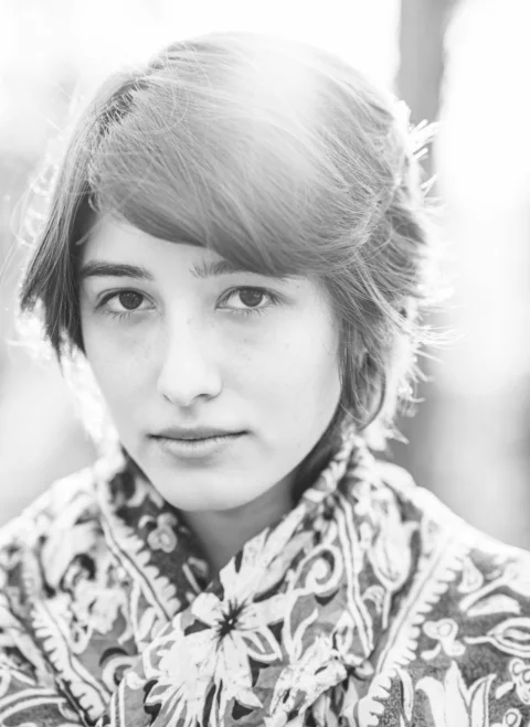 a black and white photo of a young woman