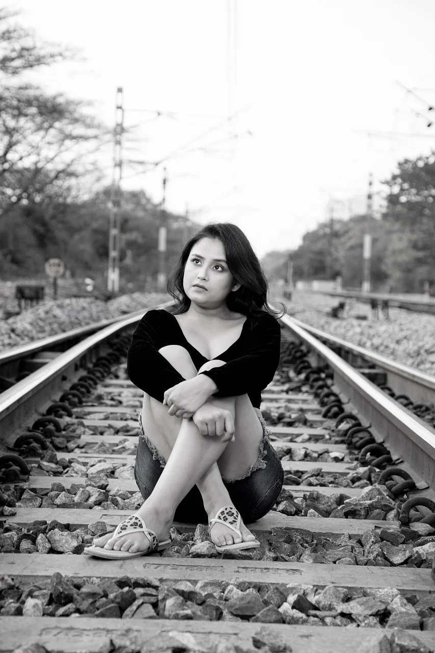 indian woman, outdoors, railroad, train track