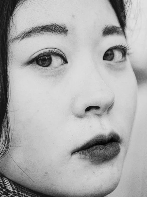 a black and white photo of a woman's face