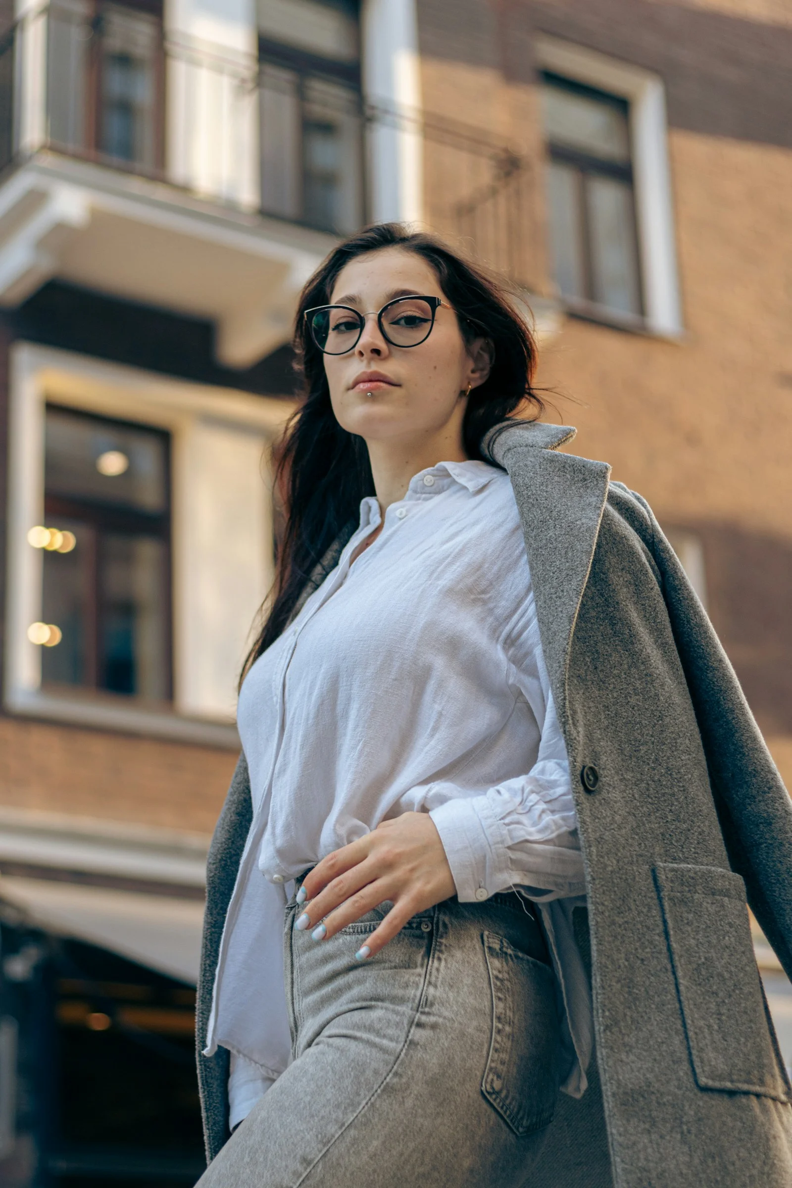 A confident woman poses in the city