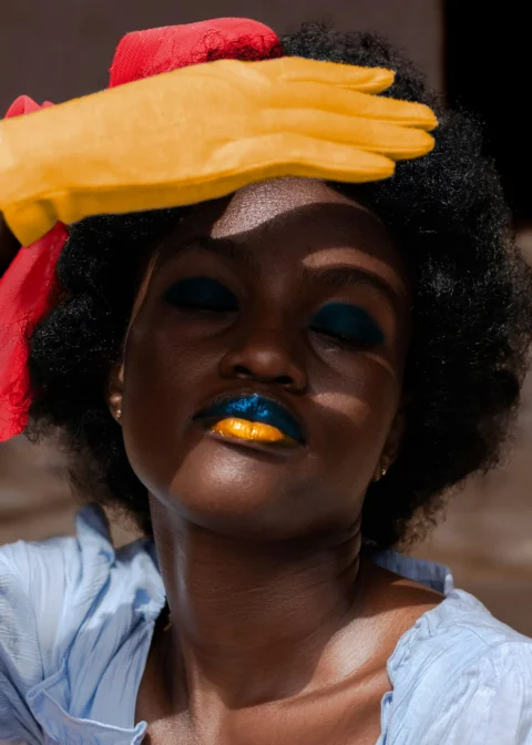 a woman with a yellow glove on her head