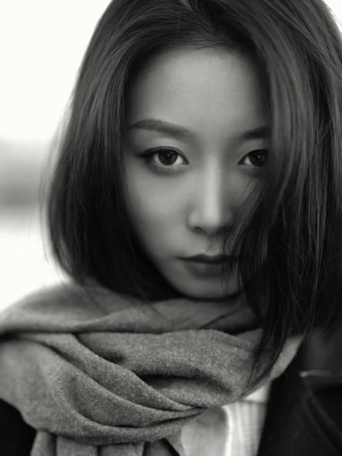 a woman with a scarf around her neck