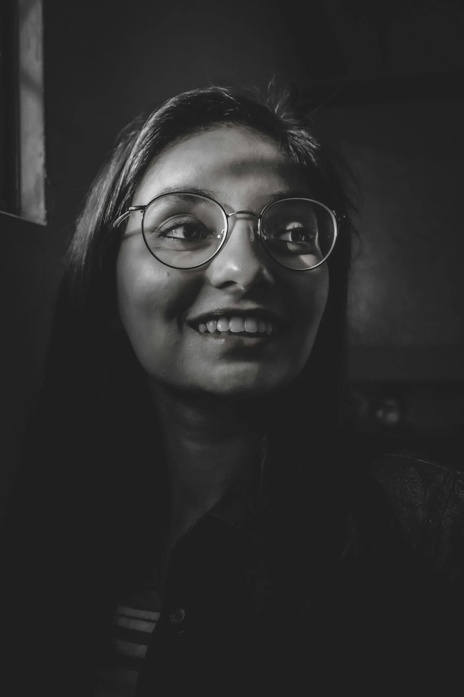 woman wearing black framed eyeglasses