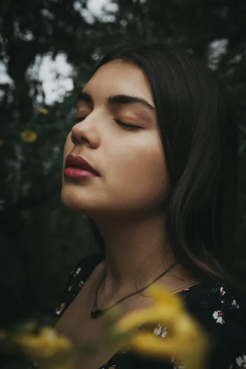 woman in black and yellow floral shirt
