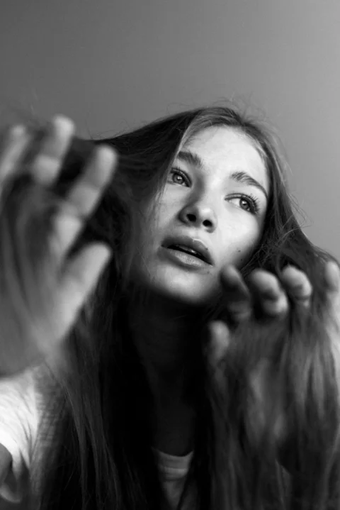 grayscale photo of woman with long hair