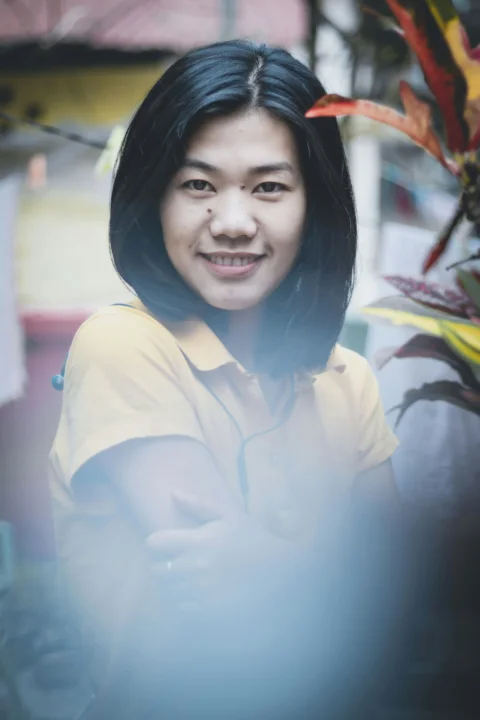 smiling woman in white button up shirt