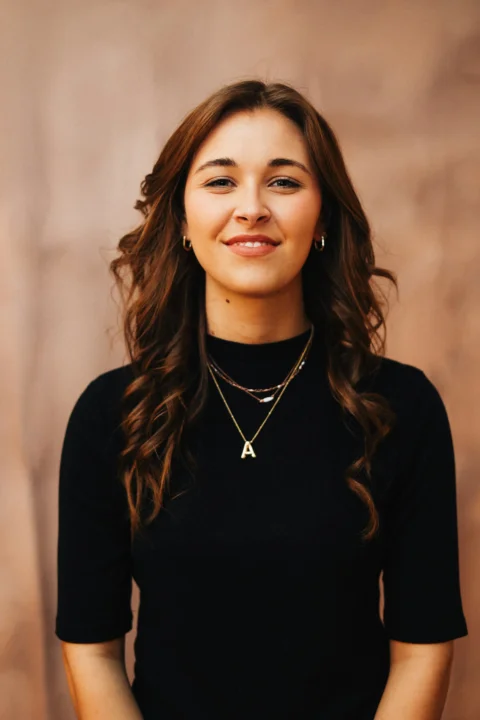 A smiling woman poses for a portrait