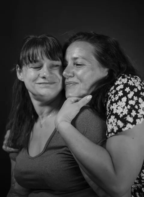 Two women share a tender moment together