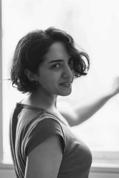 a woman with her arm up