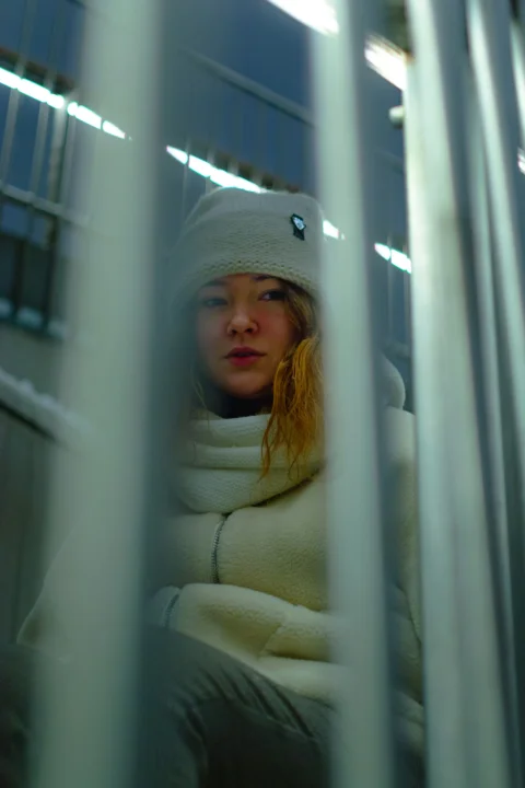 woman in white knit cap and white scarf