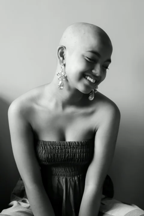 woman in tube dress smiling