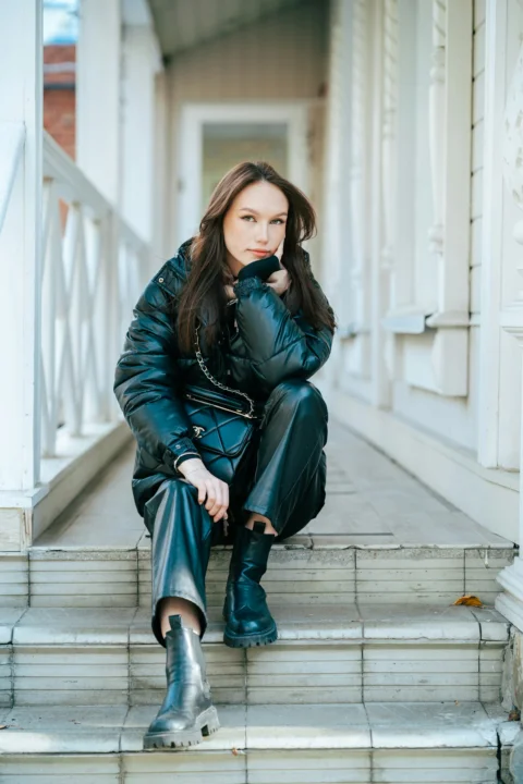 a woman sitting on stairs