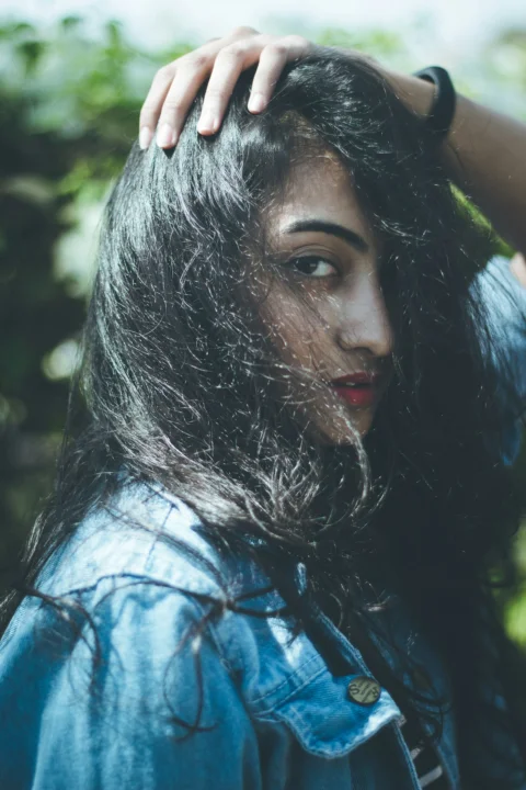 woman in white and blue shirt with red lipstick