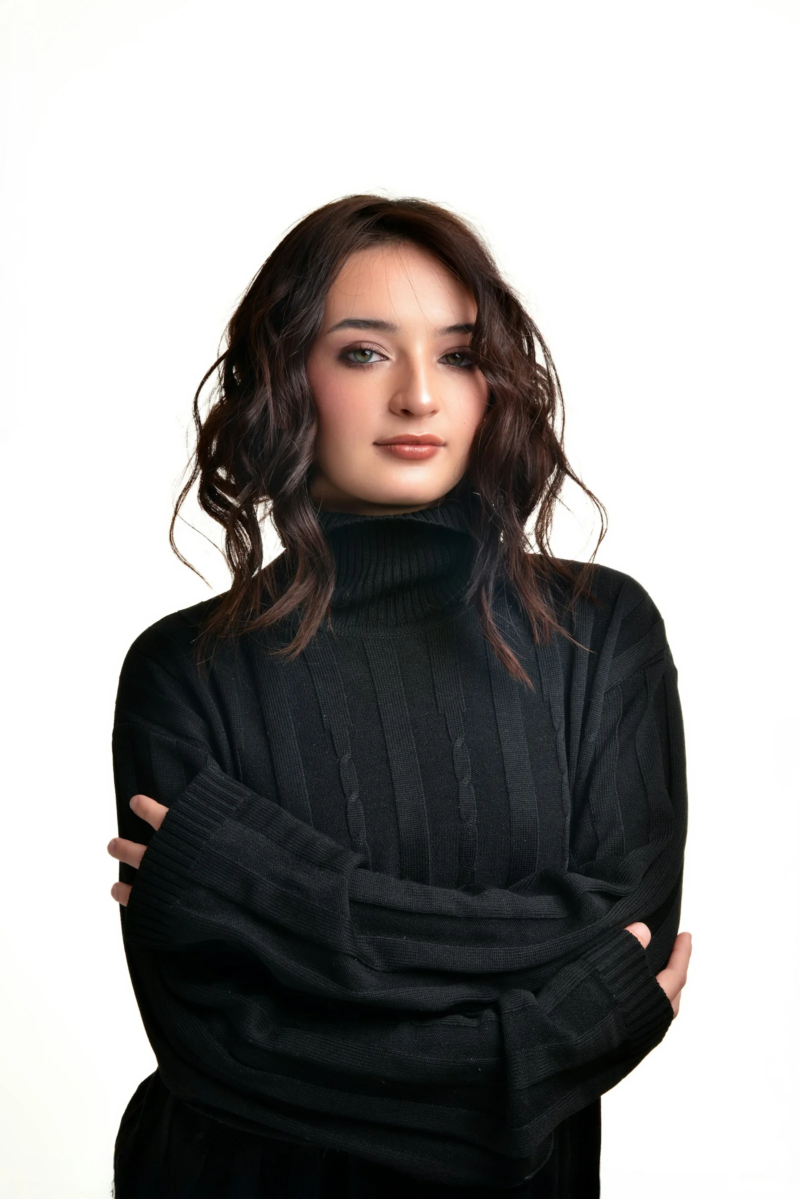 A young woman wearing a black turtleneck sweater