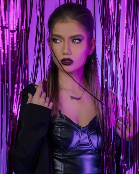 a woman in a leather outfit posing for a picture