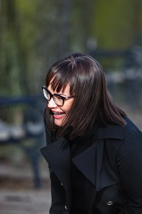 woman, laughing, black, coat