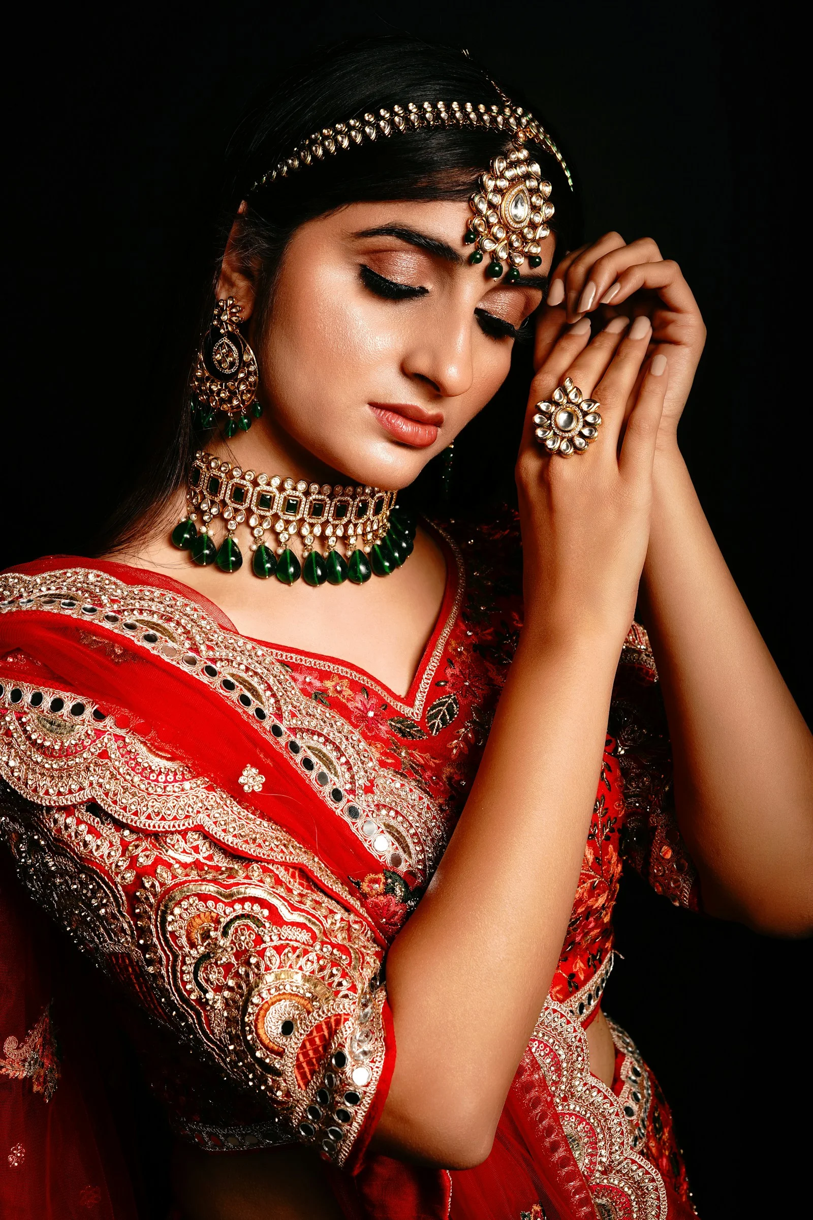 a woman wearing a red dress and a crown