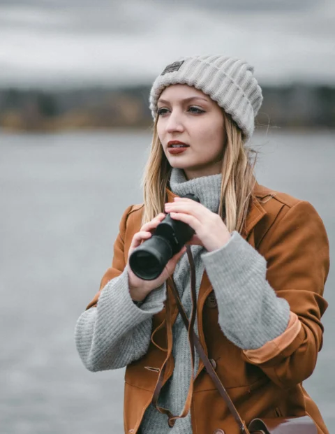 a woman holding a camera