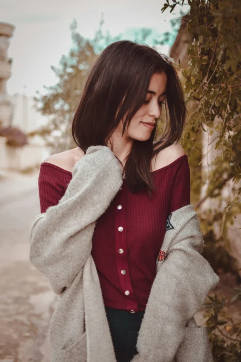 woman holding her neck