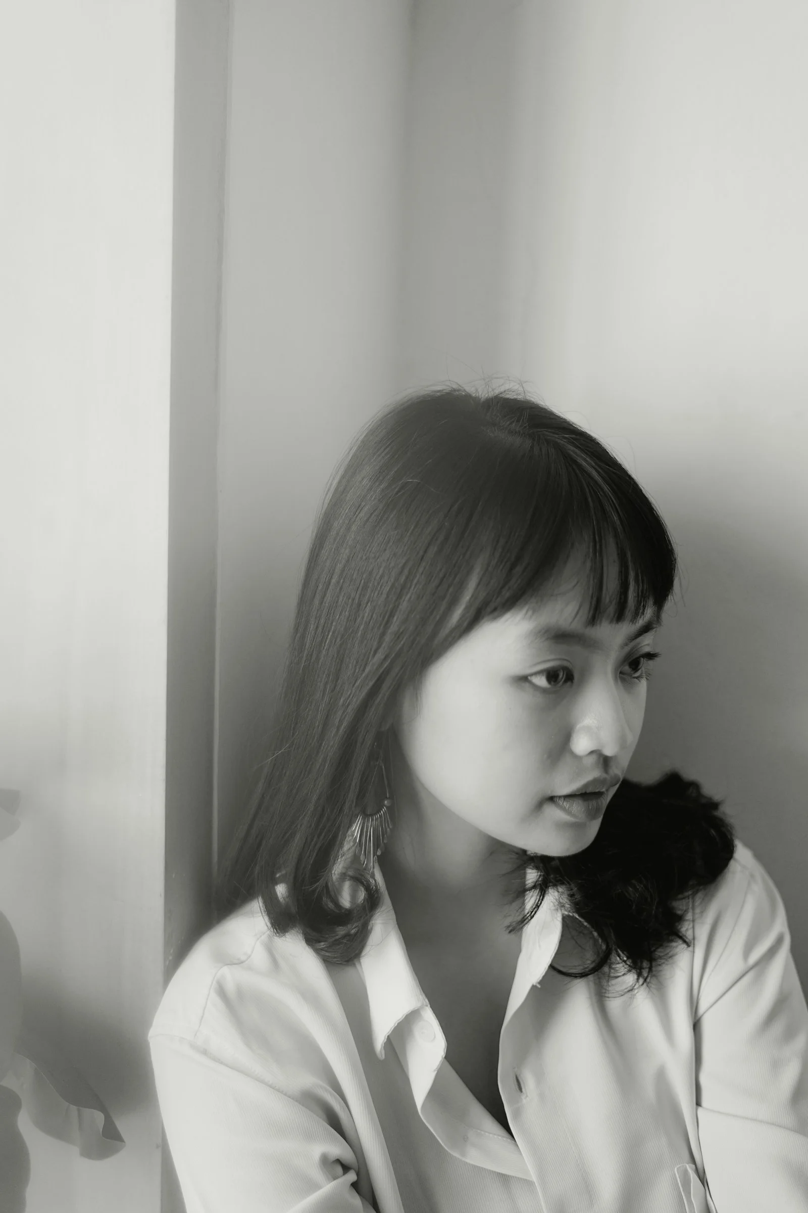 grayscale photo of woman in white shirt