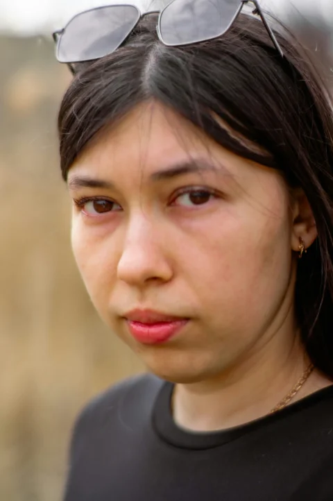A young woman poses for a portrait