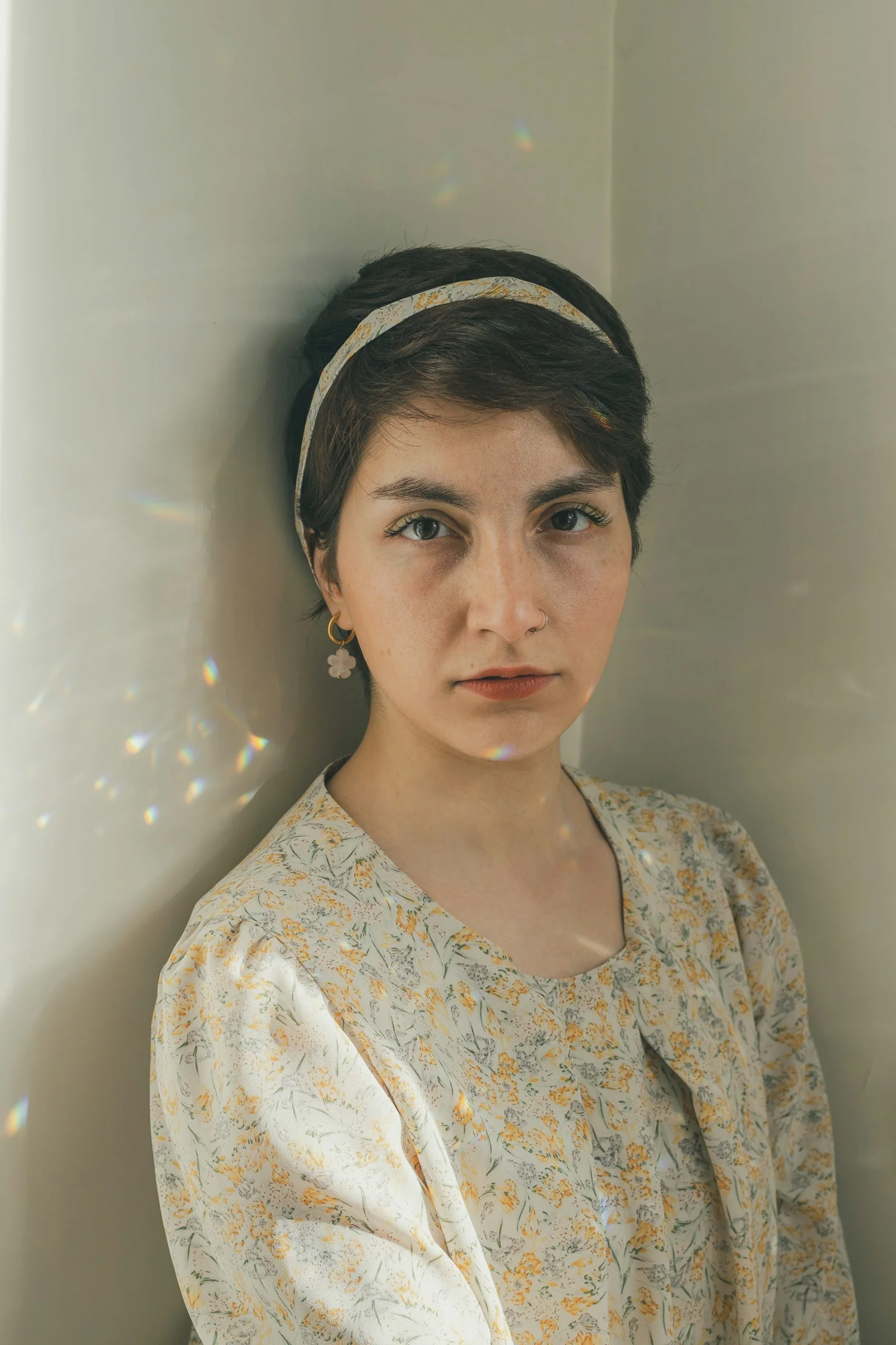 Young woman with short hair and floral dress