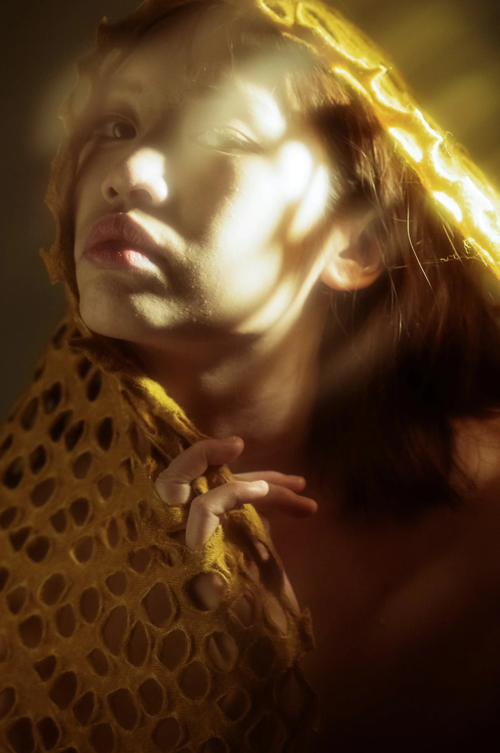 A woman with a yellow scarf around her neck