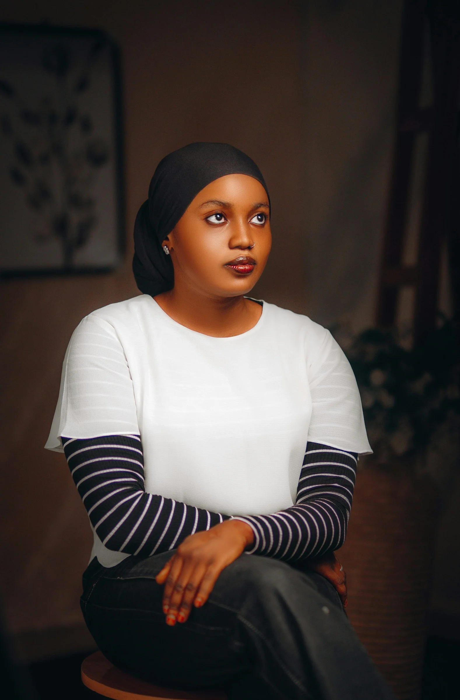 Young woman in hijab looking away thoughtfully