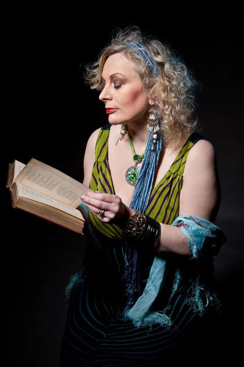 mature woman, story teller, reading, book