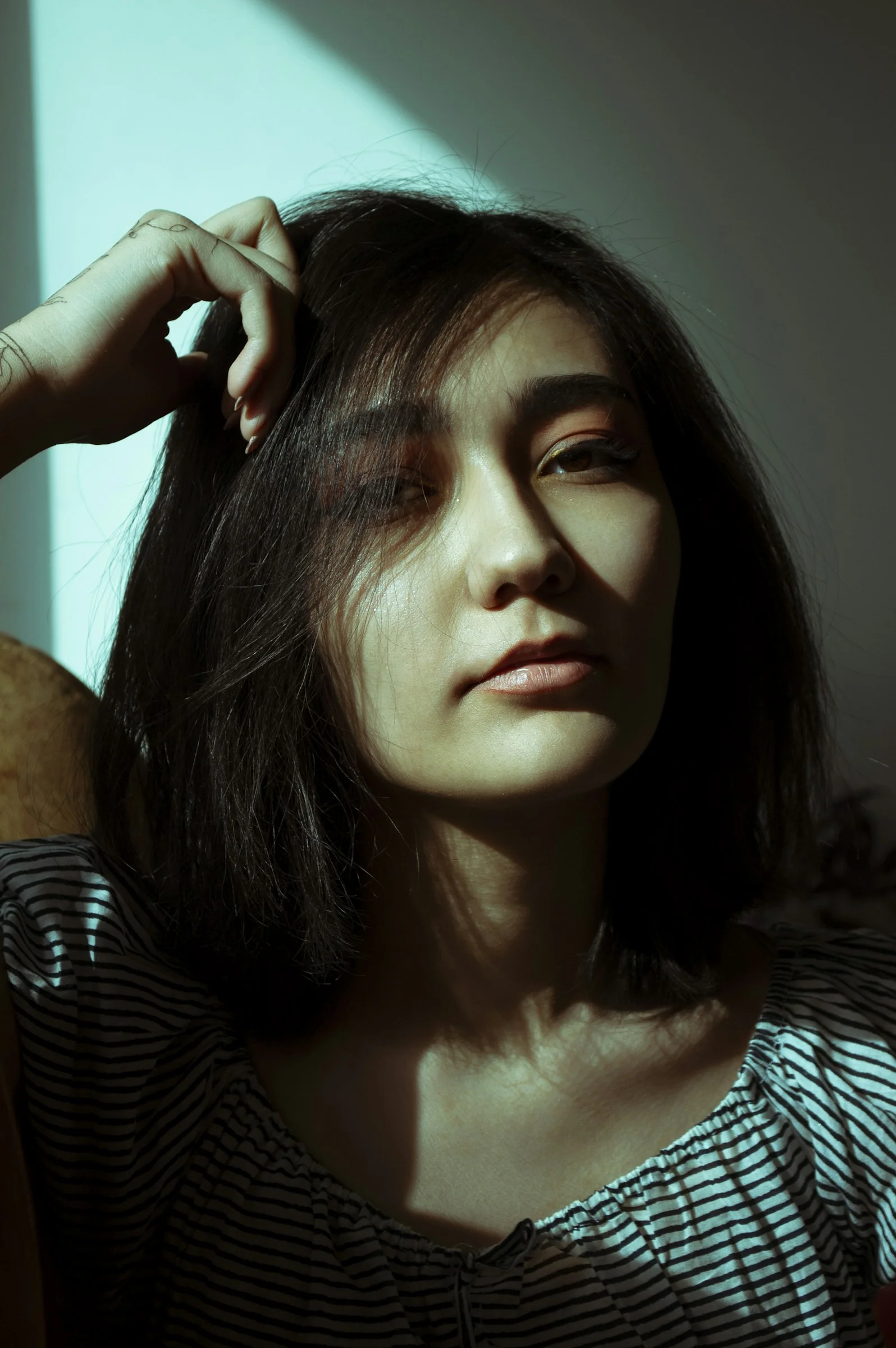 woman in black and white striped shirt