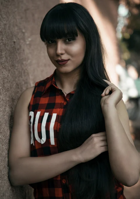 woman in red and white stripe sleeveless dress