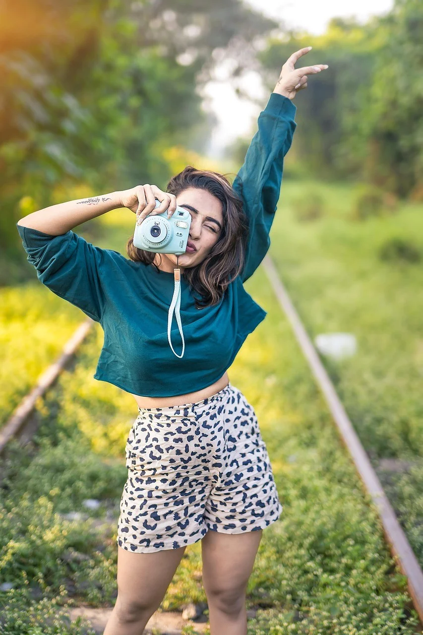 polaroid camera, woman, outdoors, indian woman