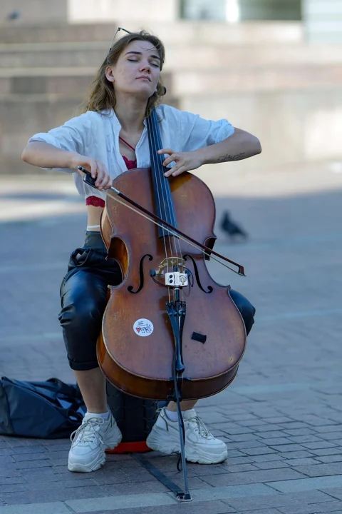 woman, cellist, busker, playing