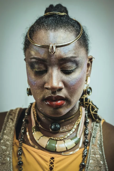 Woman with elaborate makeup and jewelry