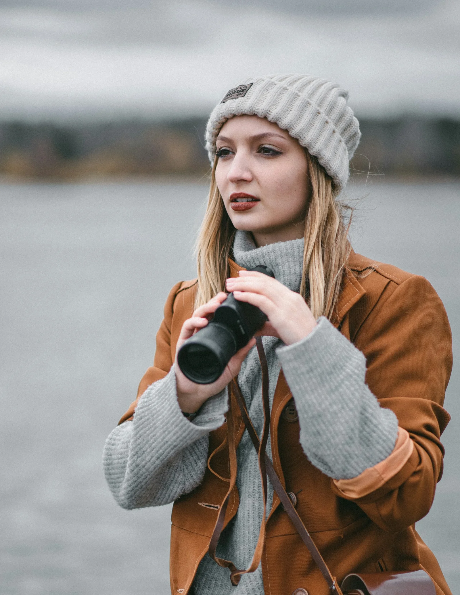 a woman holding a camera